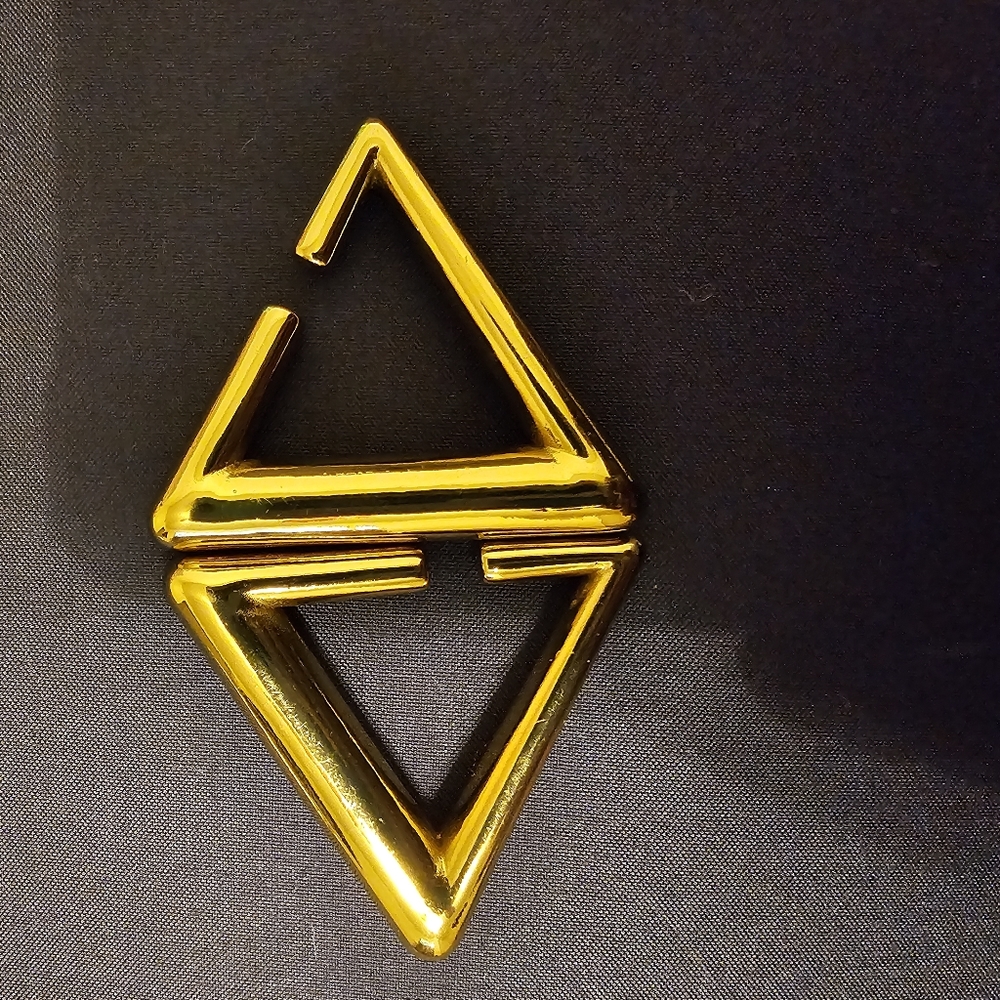 Gold weighted hangers for stretched ears.
